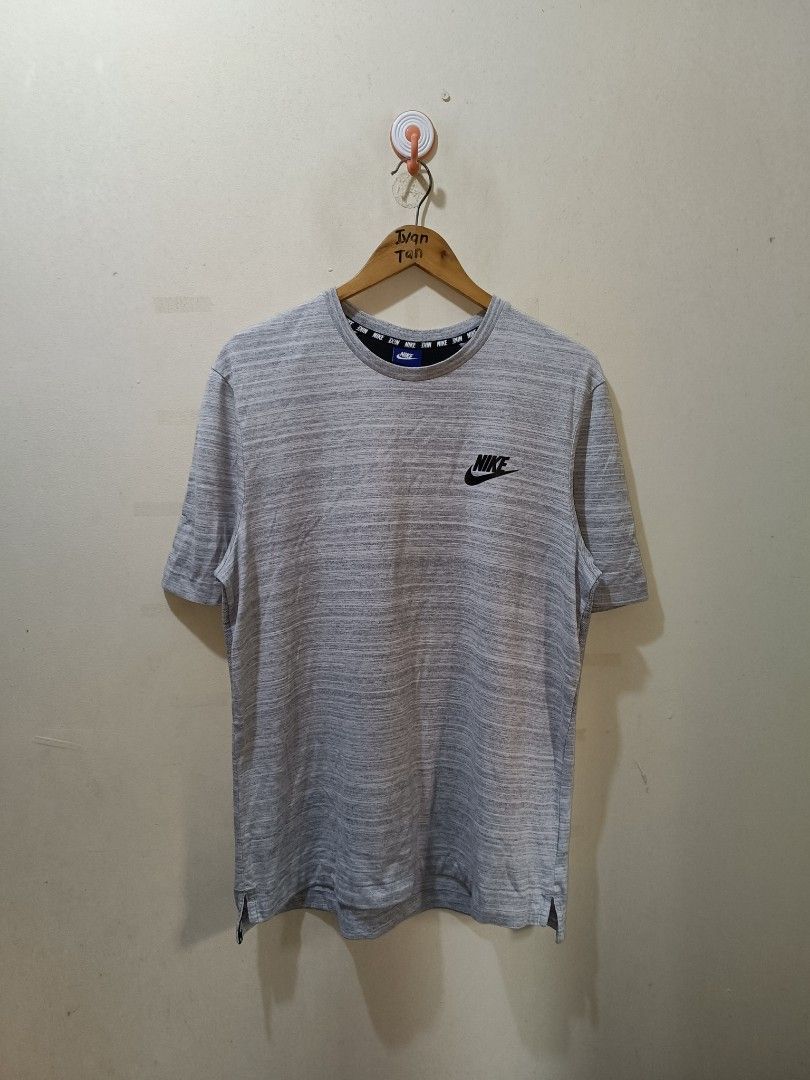 Nike Shirt (Category: Tshirts & Polo Shirts ) located in Makati City. Submitted by ivsseyow03 (Listing ID 1469278937, Image 1). Description: Gray heathered crew neck t-shirt from Nike. Black Nike logo printed on the left chest. Interior collar features repeating Nike text taping detail. Size large tag attached at the inner blue neck label. Side slits at the bottom hem for extra mobility. Cotton blend fabric, soft and comfortable. Standard fit..
