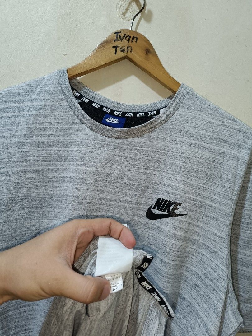 Nike Shirt (Category: Tshirts & Polo Shirts ) located in Makati City. Submitted by ivsseyow03 (Listing ID 1469278937, Image 3). Description: Gray heathered crew neck t-shirt from Nike. Black Nike logo printed on the left chest. Interior collar features repeating Nike text taping detail. Size large tag attached at the inner blue neck label. Side slits at the bottom hem for extra mobility. Cotton blend fabric, soft and comfortable. Standard fit..