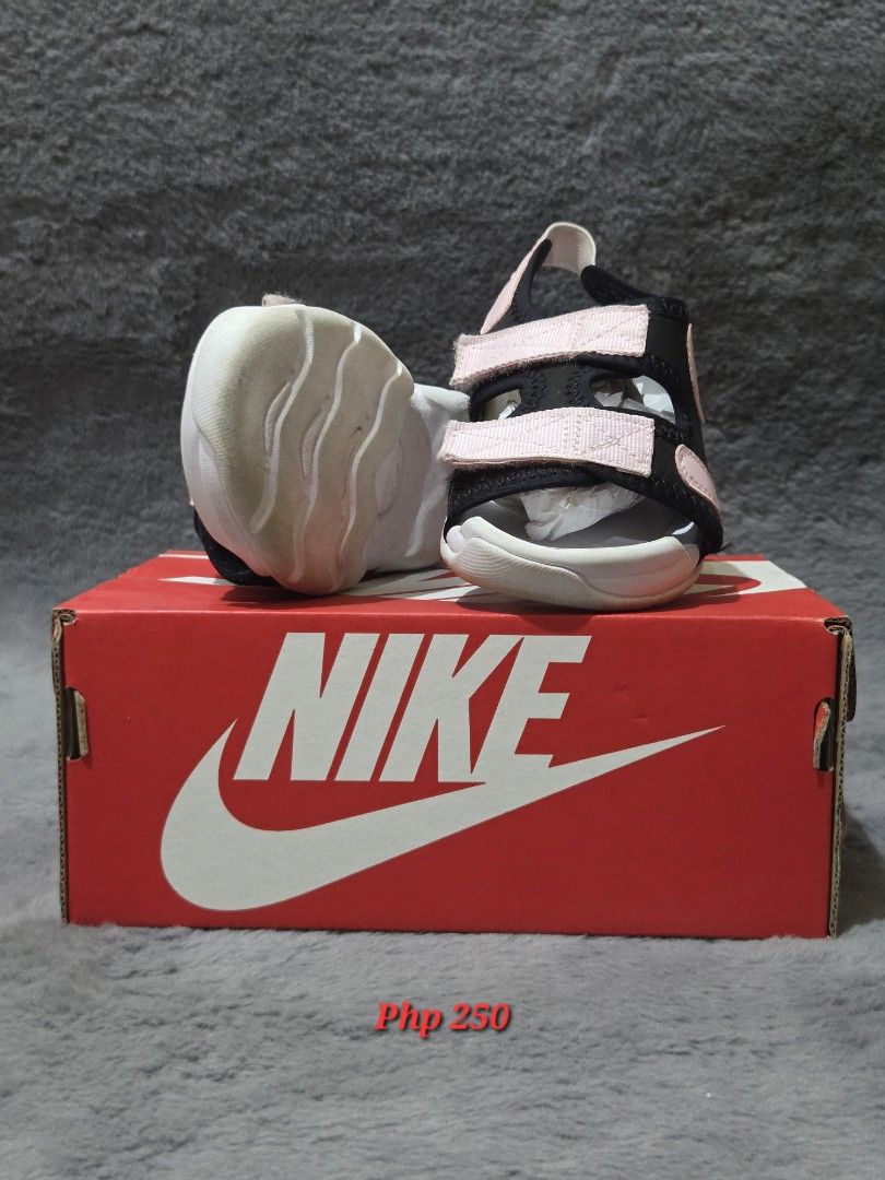 Nike Sunray Adjust 6 (Category: Babies & Kids Fashion) located in Bulacan. Submitted by gtrvddg (Listing ID 1469224541, Image 2). Description: - Brand: Nike Sunray Adjust 6 (Kids) - Color: Black strap with pink foam accents and white sole - Size: US 9C / UK 8.5 / CM 15 / EUR 26 - Condition: Clean, never worn out - Inclusions: Comes with original red Nike box.