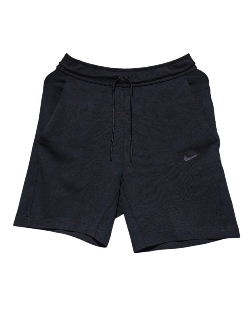 Nike Tech Fleece Shorts Black Size S (Category: Shorts) located in Maasim. Submitted by ukayganda25 (Listing ID 1469269739, Image 2). Description: - Brand/Model: Nike Tech Fleece Shorts (Style: 928514-011) - Color: Black - Size: Small (Waist: 28-30 inches, Length: 19.5 inches) - Material: 69% Cotton, 31% Polyester - Pockets: Signature side zip pocket + standard front pockets - Fit: Adjustable drawstring waistband - Condition: Excellent, clean ins