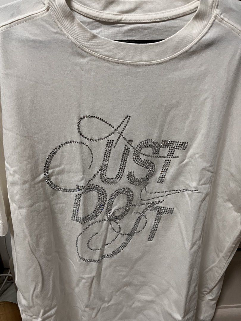 Nike The Nike Tee Oversized Rhinestone Just Do It (Category: Shirts) located in Meycauayan. Submitted by ranastridran (Listing ID 1469262567, Image 1). Description: - Brand: Nike - Color: White - Fit: Oversized - Design: Sparkling rhinestone 'Just Do It' graphic and swoosh logo - Material: 100% cotton - Condition: Clean, brand new with tags intact - Origin: Made in China.