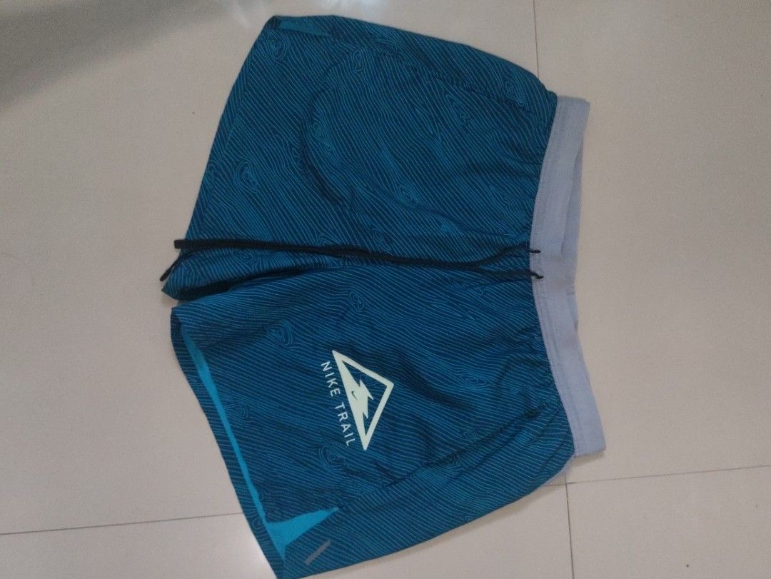Nike Trail Running Shorts (Category: Shorts) located in Manila. Submitted by quickcloud-e6c9ef (Listing ID 1469225175, Image 2). Description: - Authentic Nike Trail running shorts - Stylish topographical map print design - Secure elastic waistband with internal drawstring - Iconic Nike Trail logo on the left leg - Lightweight, breathable fabric ideal for workouts and outdoor trails 1400 each.