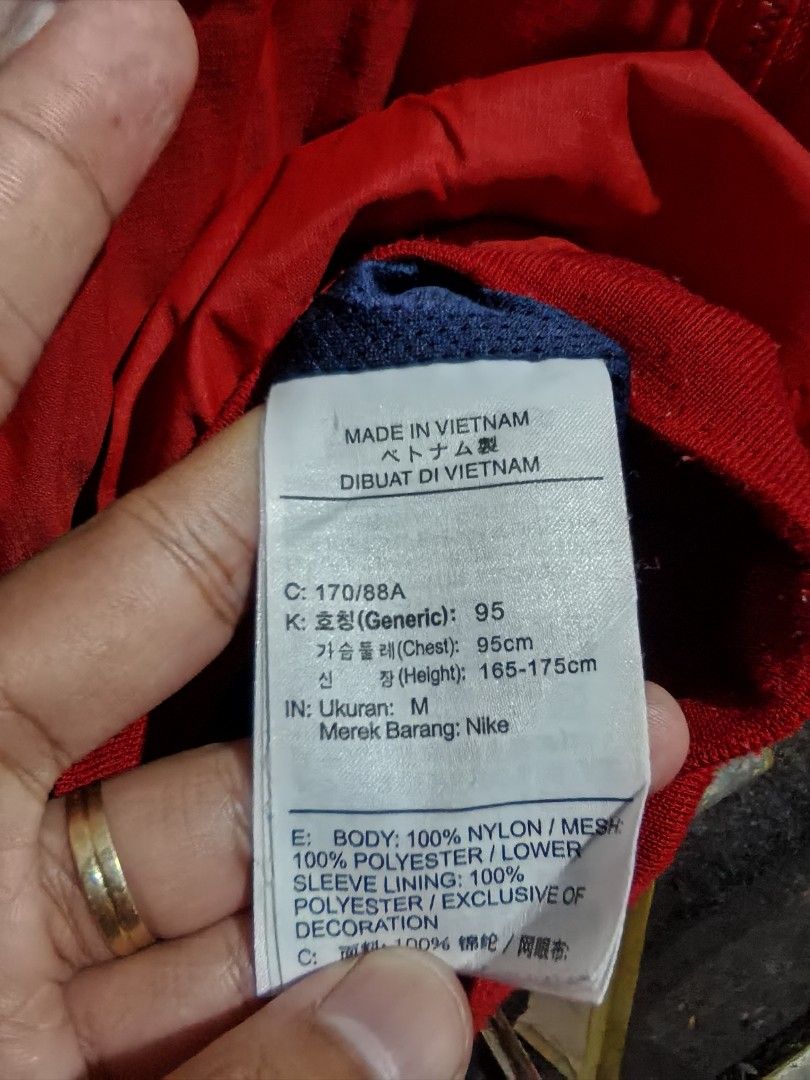 Nike Windrunner Hooded Jacket Red White Blue Size M (Category: Coats, Jackets and Outerwear) located in Quezon. Submitted by miksxthrift (Listing ID 1469313411, Image 3). Description: - Brand: Nike - Style: Windrunner jacket with hood and full zip closure - Colorway: Red, white, and blue colorblock - Size: Tagged M (Fits chest 95cm, height 165-175cm) - Material: 100% nylon body with breathable polyester mesh lining - Features: Front zip pockets, 
