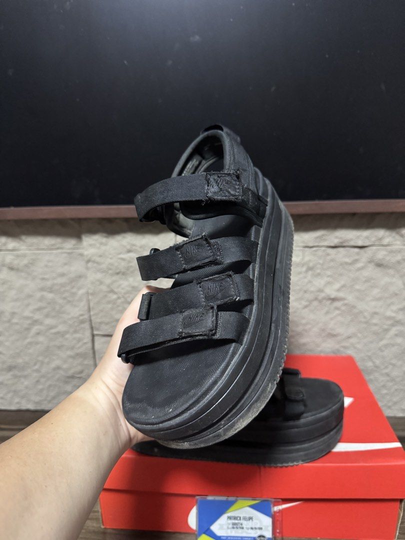 Nike Women's Platform Sandals Black (Category: Sandals) located in Caloocan City. Submitted by onetwelvetwelve (Listing ID 1469317186, Image 3). Description: - Authentic Nike platform sandals in a versatile triple black colorway - Chunky layered midsole design offering extra height and comfort - Multiple adjustable strap closures across the foot and heel for a secure fit - Subtle Nike branding on the strap tabs - Comes with the original red box -