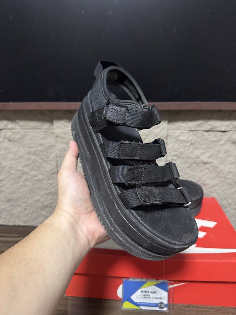 Nike Women's Platform Sandals Black (Category: Sandals) located in Caloocan City. Submitted by onetwelvetwelve (Listing ID 1469317186, Image 2). Description: - Authentic Nike platform sandals in a versatile triple black colorway - Chunky layered midsole design offering extra height and comfort - Multiple adjustable strap closures across the foot and heel for a secure fit - Subtle Nike branding on the strap tabs - Comes with the original red box -