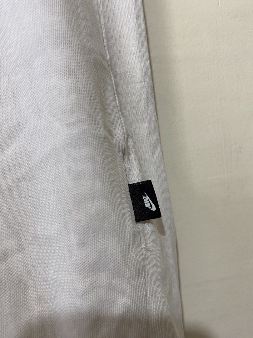 NIKE,T-shirt (Category: Tshirts & Polo Shirts ) located in Cavite. Submitted by jc_thrift95 (Listing ID 1469315532, Image 3). Description: - a white Nike Sportswear “Nike Moving Co.” Tee. - Made in Vietnam - L- 27 inch - W- 18 inch - Color rate 8/10 - See picture details for dimes..