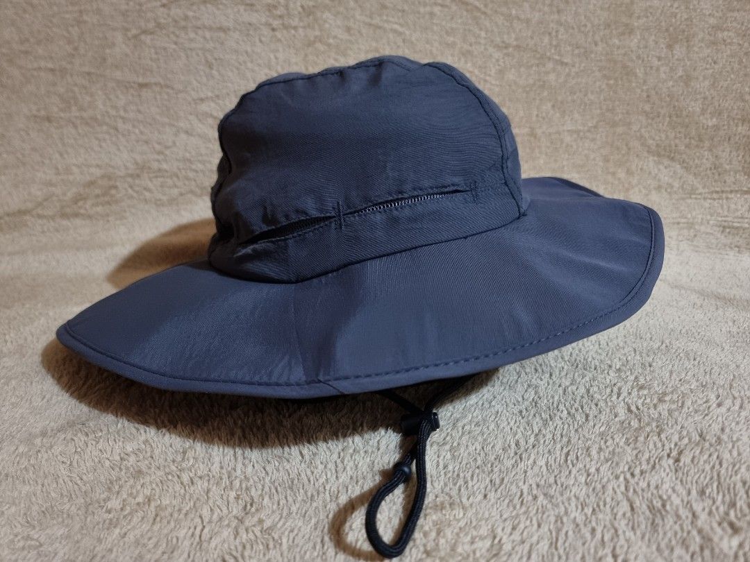 NIKKO Outdoor Bucket Hat (Category: Hats & Beanies) located in Imus. Submitted by aim_for_less (Listing ID 1469306316, Image 2). Description: NIKKO Outdoor Bucket Hat - Brand: NIKKO - SIZE: 60CM - Color: Dark grey - Wide brim for maximum sun protection - Adjustable black chin cord with toggle for a secure fit - Lightweight material with breathable inner mesh lining - Features the brand logo printed on the side - Ideal for hiking, fishing, gardeni