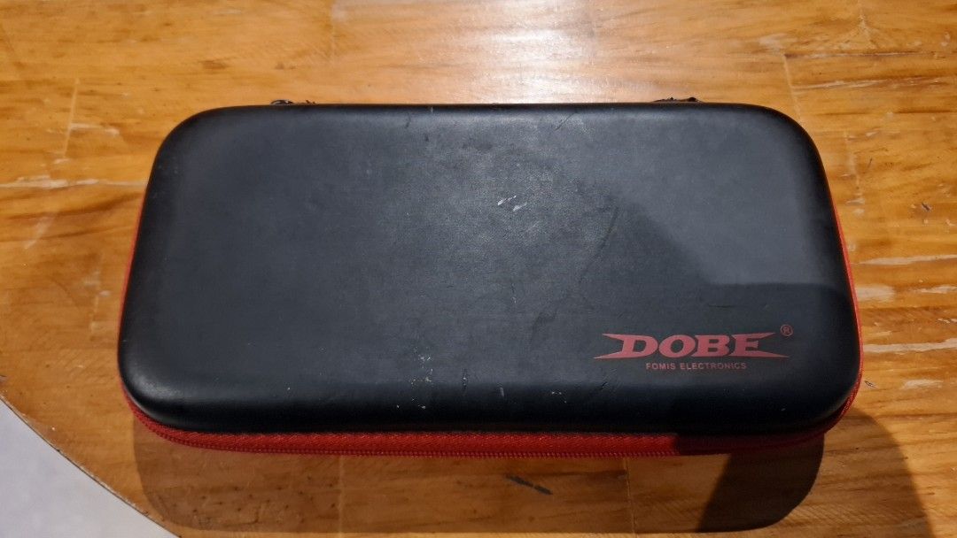 Nintendo Switch Lite Turquoise with Case and Charger (Category: Nintendo) located in Quezon City. Submitted by cyulaters (Listing ID 1469312242, Image 2). Description: - Item: Nintendo Switch Lite Handheld Console - Color: Turquoise - Included: Original power adapter and black Dobe carrying case with red trim - Condition: Has some screen burn in its corners 😀 the Screen, joysticks, and buttons are clean and fully functional though; normal wear o
