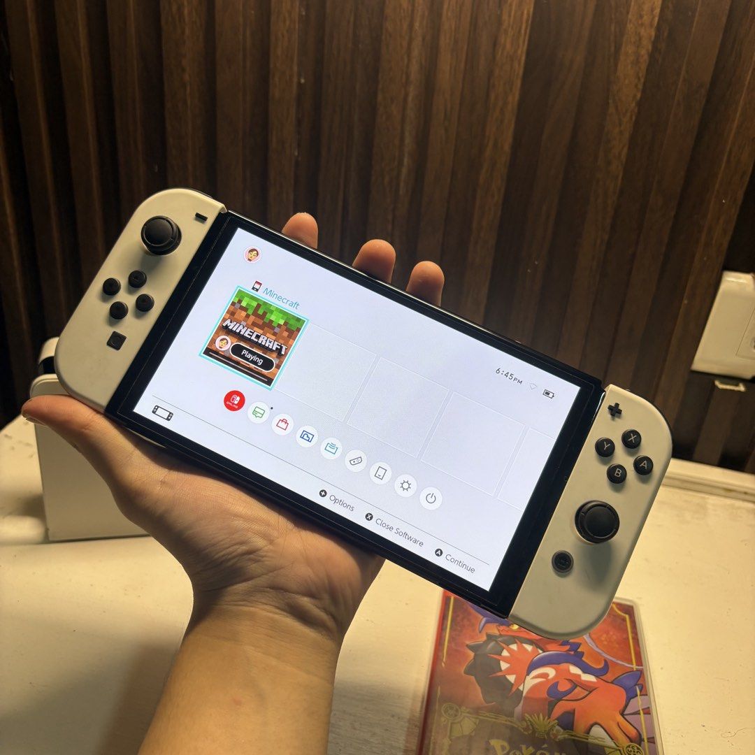 Nintendo Switch OLED 64GB (Category: Nintendo) located in Manila. Submitted by ghelo23 (Listing ID 1469166164, Image 2). Description: Nintendo Switch OLED 64GB - With dock hdmi and power cable - No issue With Physical Games: - Pokemon Scarlet - Minecraft ₱10,999.