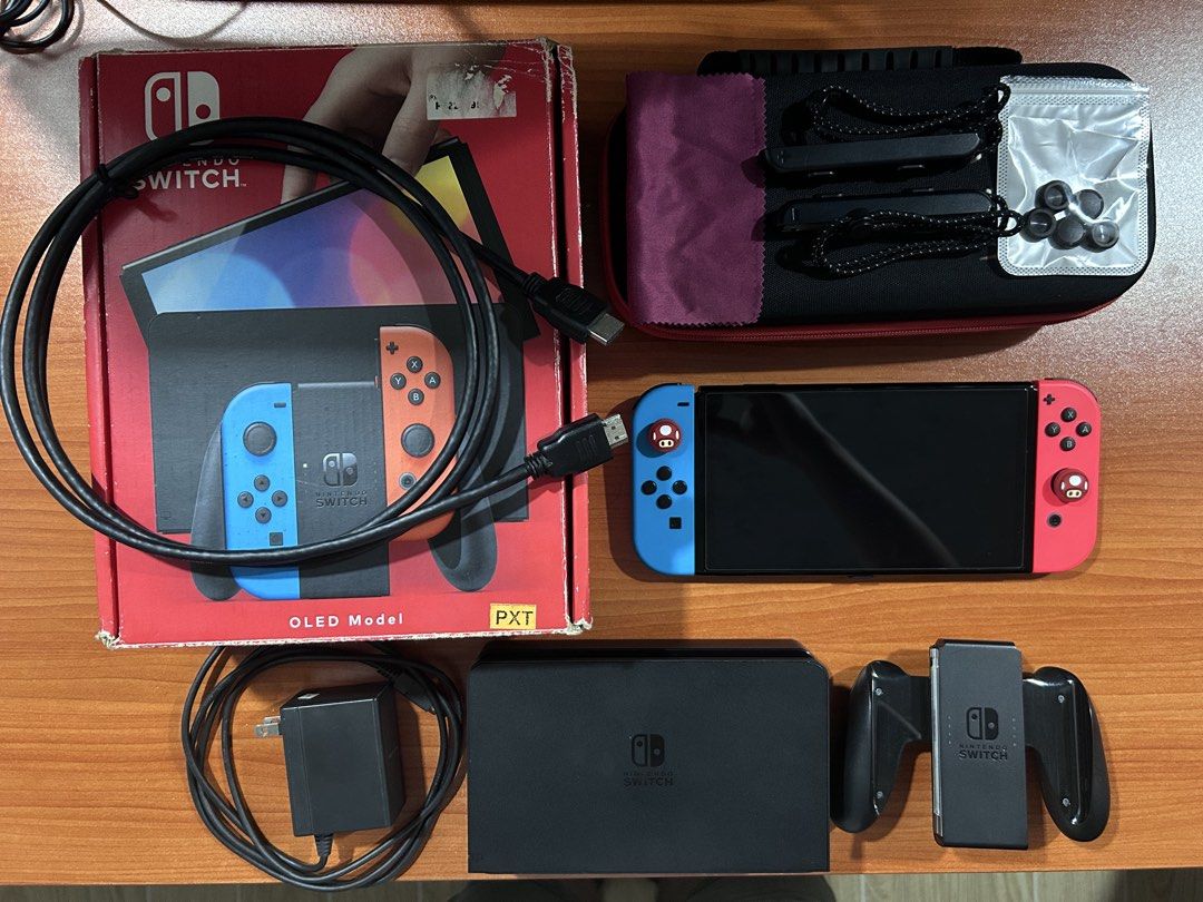 Nintendo Switch OLED Model (Category: Nintendo) located in Silang. Submitted by niknox (Listing ID 1469307657, Image 2). Description: 🎮 FOR SALE: NINTENDO SWITCH OLED Selling my Nintendo Switch OLED with 64gb internal storage and complete accessories 🔴 ✨ Inclusions: ✅ Nintendo Switch console w/ screen protector ✅ Joy-Cons w/ thumb grips ✅ Dock ✅ HDMI Cable ✅ Charger/adapter ✅ Joy-Con grip ✅ Joy-Con straps ✅ DOBE Carrying case w/ microfiber clot
