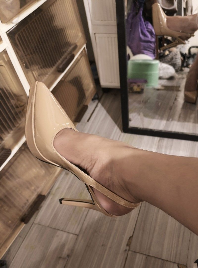 Nude Patent Slingback Platform Stiletto High Heels (Category: Heels) located in Del Monte. Submitted by simplyjmgc (Listing ID 1469335220, Image 3). Description: - Material: Nude patent leatherette with a glossy finish - Design: Pointed toe with a stylish front platform - Heel: Slim stiletto high heel with sturdy construction - Fit: Slingback strap featuring an elastic gore for comfort - Versatility: Neutral nude shade easily matches multiple out