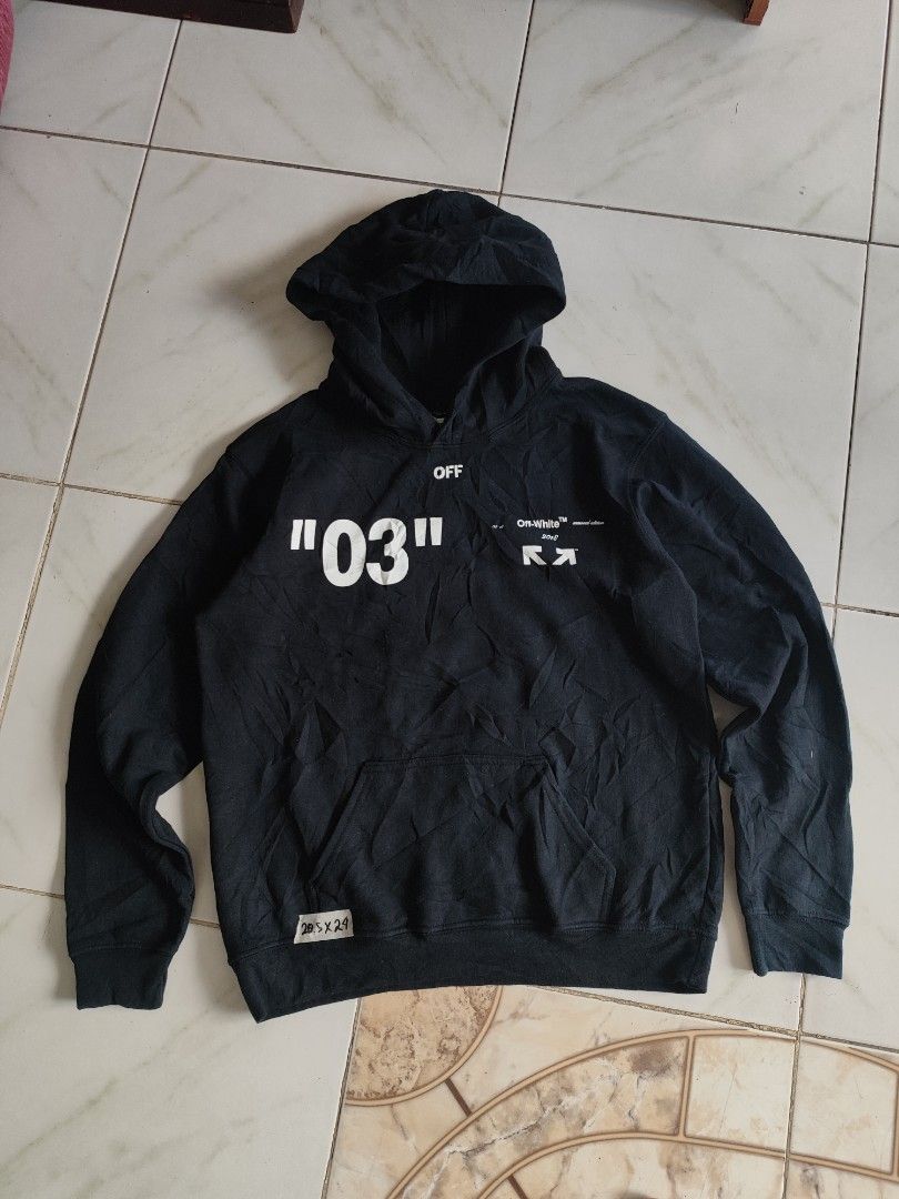 Off-White Black Arrows 03 Hoodie (Category: Coats, Jackets and Outerwear) located in Tuguegarao City. Submitted by johnpetera0818 (Listing ID 1469214075, Image 2). Description: - Brand: Off-White -20.5 width 24 length - Color: Black - Design: Bold '03' print on front, classic diagonal arrows and seasonal text on back - Details: Drawstring hood with branded ribbon - Material: Soft fleece interior for extra warmth - Origin: Made in Portugal - Condi