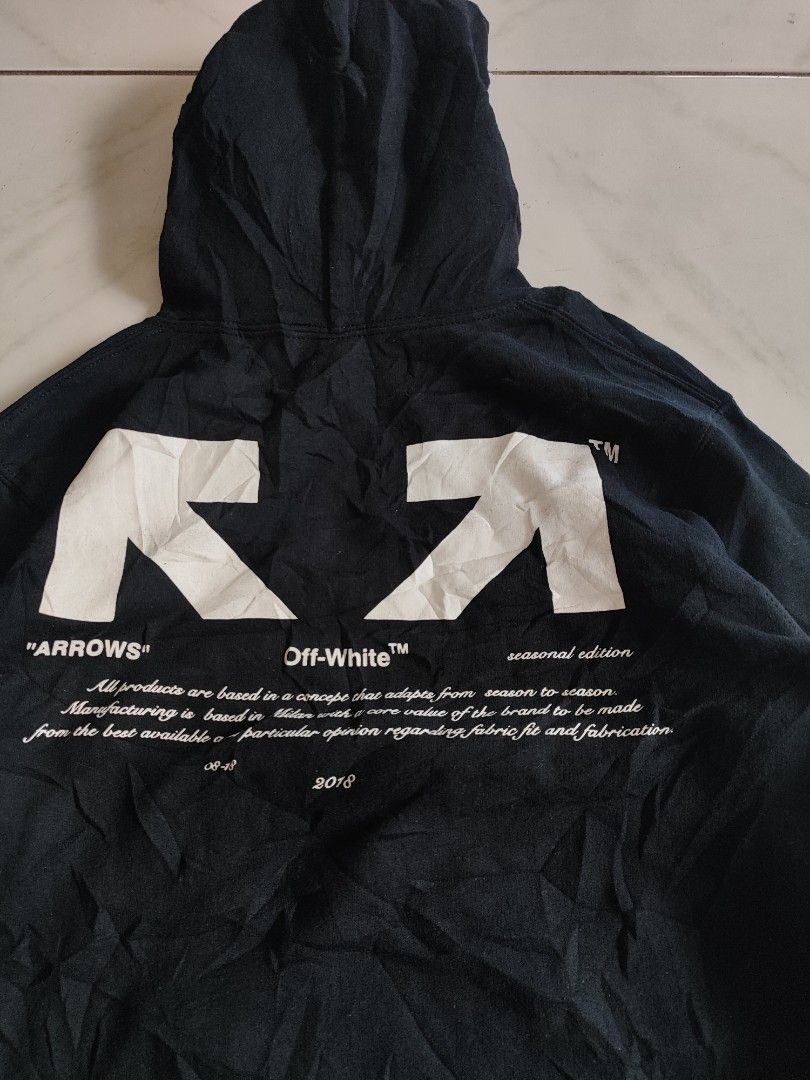 Off-White Black Arrows 03 Hoodie (Category: Coats, Jackets and Outerwear) located in Tuguegarao City. Submitted by johnpetera0818 (Listing ID 1469214075, Image 3). Description: - Brand: Off-White -20.5 width 24 length - Color: Black - Design: Bold '03' print on front, classic diagonal arrows and seasonal text on back - Details: Drawstring hood with branded ribbon - Material: Soft fleece interior for extra warmth - Origin: Made in Portugal - Condi