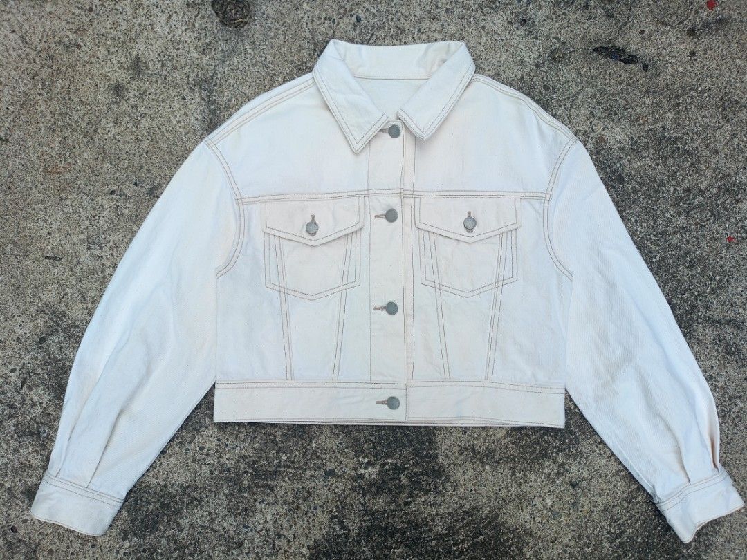 Off-white cropped denim jacket with contrast stitching (Category: Coats, Jackets and Outerwear) located in General Santos City (Dadiangas). Submitted by jay-fits (Listing ID 1469293211, Image 1). Description: GU Women's Denim Volume Sleeve Jacket GU Women's Denim Volume Sleeve Jacket Small on tag 19.5x18.5 Denim Color Rate 10/10, 🔥 Excellent Condition, No Issue Location Davao City Mine 590+Sf .