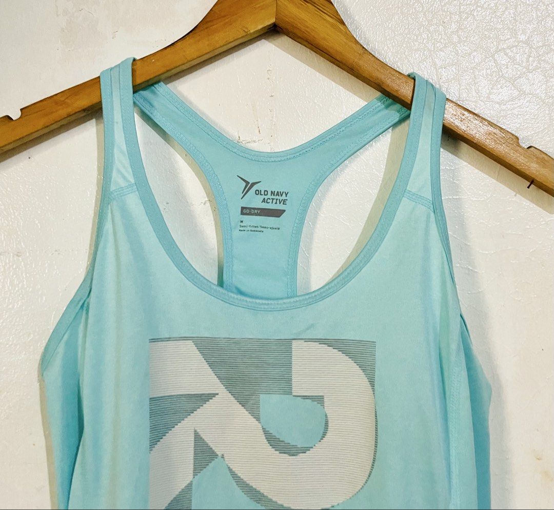 Old Navy Active Go-Dry Racerback Tank Top (Category: Activewear) located in Caloocan City. Submitted by lovemyclothes21 (Listing ID 1469270194, Image 2). Description: - Brand: Old Navy Active - Size: Medium - Color: Light Blue - Material: Go-Dry moisture-wicking fabric to keep you cool and dry - Design: Racerback cut with a bold geometric graphic on the front - Fit: Semi-fitted, ideal for workouts, running, or casual wear.