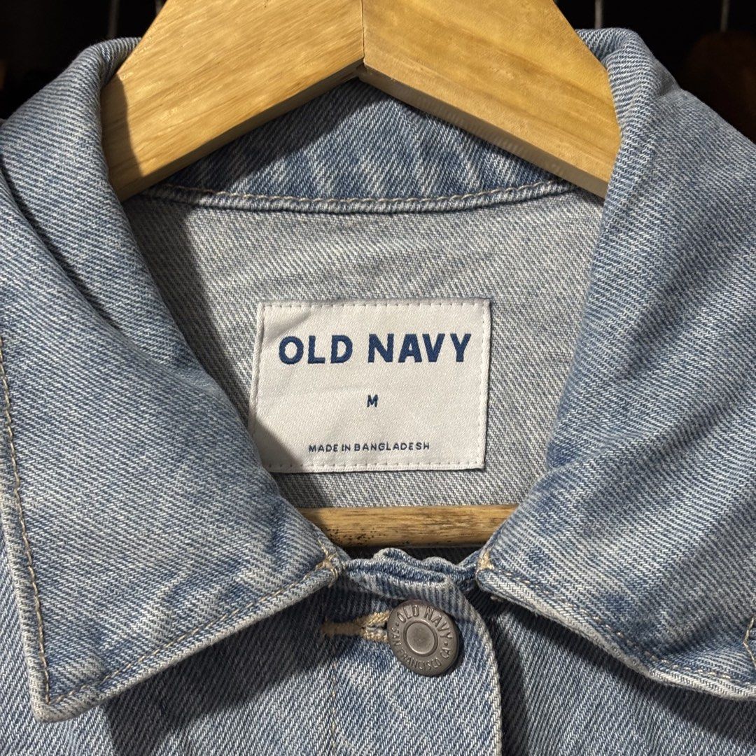 Old Navy Light Wash Denim Jacket Size Medium (Category: Coats, Jackets and Outerwear) located in Caloocan City. Submitted by bonsatocha43876 (Listing ID 1469322168, Image 3). Description: - Brand: Old Navy - Size: Medium (Width: 20", Length: 23") - Condition: Brand new with complete tags attached - Material/Origin: Made in Bangladesh, solid light blue denim - Features: Classic collar, front button closure, two chest flap pockets, and side welt po