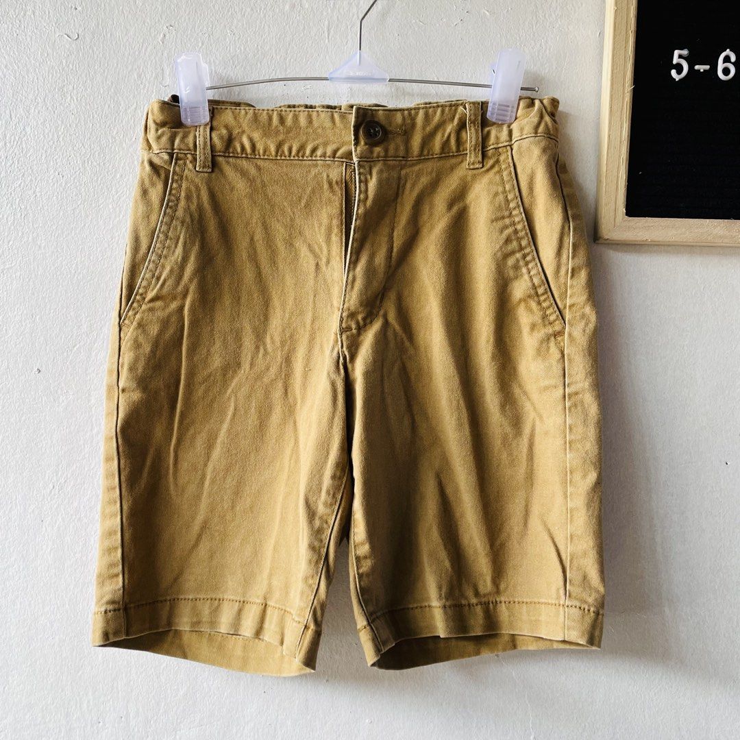 Old Navy Mustard Yellow Shorts (Category: Shorts) located in Caloocan City. Submitted by lovemyclothes21 (Listing ID 1469270841, Image 2). Description: - Brand/Style: Old Navy Kids Classic Chino Shorts - Color: Mustard Yellow - Size: 5-6 years old - Features: Front pockets, belt loops, button closure - Condition: Washed, clean, and ready for a new owner - Perfect for: Everyday casual wear in warm weather.