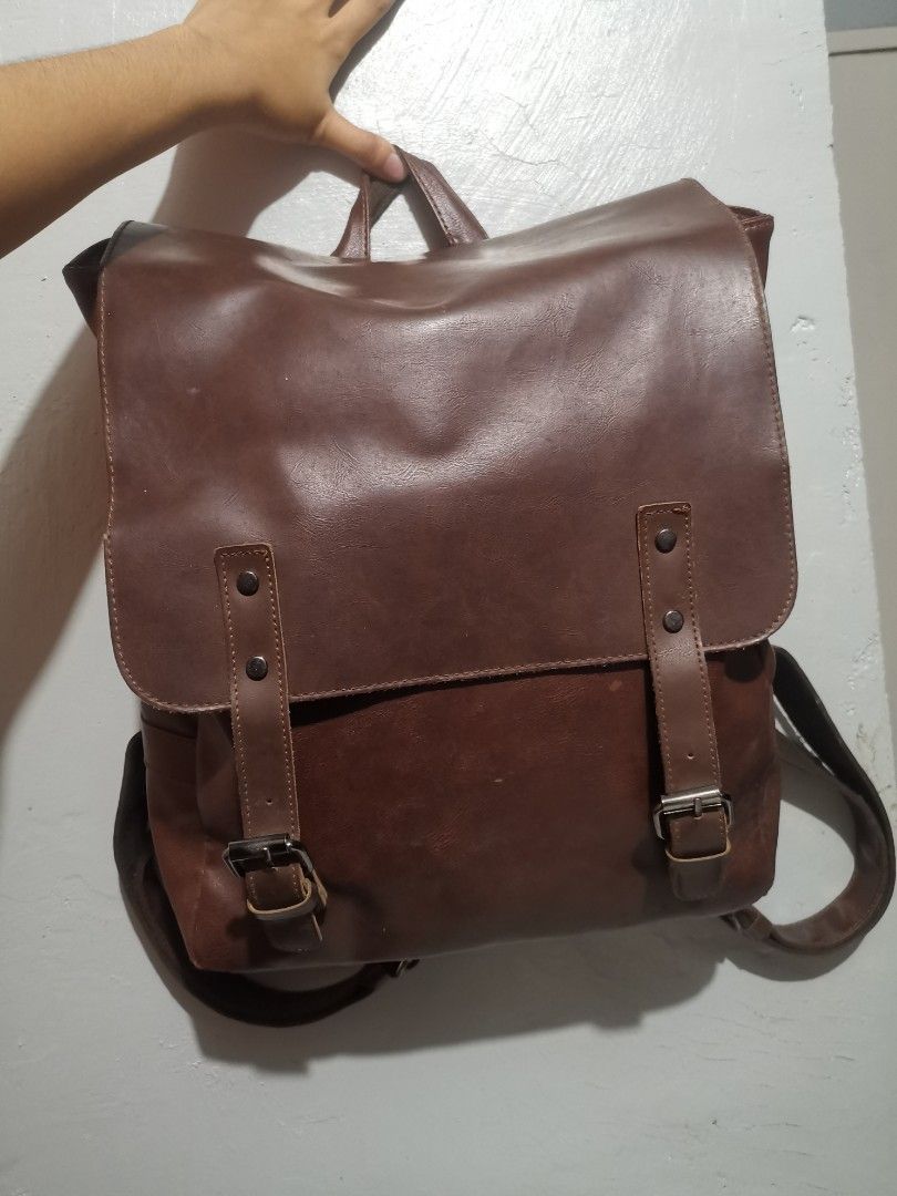 Old School Studio Baker Backpack (Category: Laptop Bags & Sleeves) located in Maramag. Submitted by allenarchive (Listing ID 1469318913, Image 3). Description: Baker Backpack by Old School Studio Price: ₱799 negotiable - Condition: 9/10 - Color: Classic Dark Brown - Style: Vintage, classic, minimalist, retro - Laptop capacity: Fits 12–14 inch laptops - Dimensions: 38 × 30 × 11 cm Flaws: 2–3 small, barely noticeable tears on the leather material. 