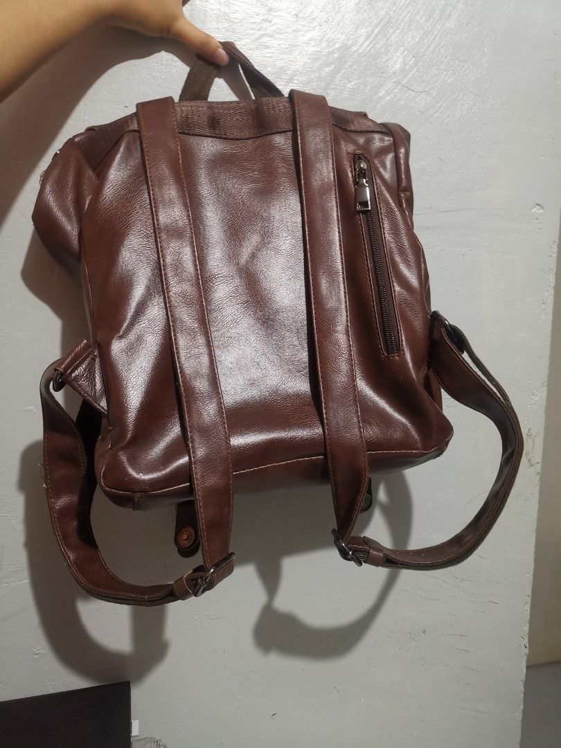 Old School Studio Baker Backpack (Category: Laptop Bags & Sleeves) located in Maramag. Submitted by allenarchive (Listing ID 1469318913, Image 2). Description: Baker Backpack by Old School Studio Price: ₱799 negotiable - Condition: 9/10 - Color: Classic Dark Brown - Style: Vintage, classic, minimalist, retro - Laptop capacity: Fits 12–14 inch laptops - Dimensions: 38 × 30 × 11 cm Flaws: 2–3 small, barely noticeable tears on the leather material. 