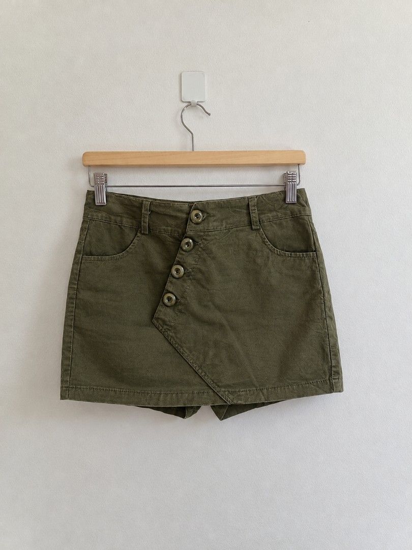 Olive green asymmetrical button front skort shorts size 28 (Category: Shorts) located in Manila. Submitted by maxinesotto (Listing ID 1469174585, Image 1). Description: SIZE: ‎large on tag ‎waistline - 28 ‎length - 12½.