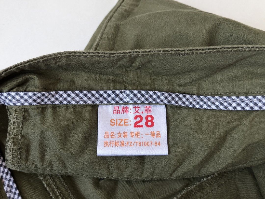Olive green asymmetrical button front skort shorts size 28 (Category: Shorts) located in Manila. Submitted by maxinesotto (Listing ID 1469174585, Image 3). Description: SIZE: ‎large on tag ‎waistline - 28 ‎length - 12½.