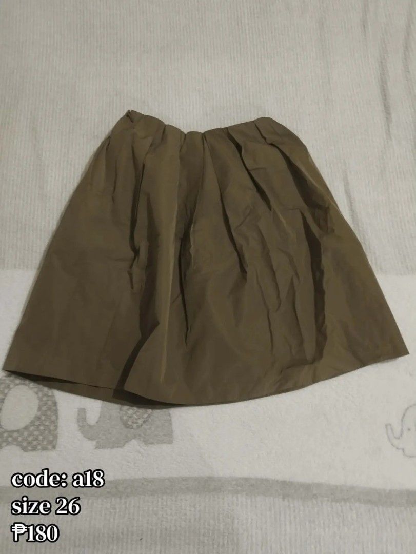 Olive Green Pleated Skirt Size 26 code a18 (Category: Skirts) located in Carmona. Submitted by ichorvault (Listing ID 1469285547, Image 1). Description: - Color: Olive green (neutral earthy tone) - Style: All-over pleats, flared cut that falls nicely - Size: 26 waistband - Fabric: Lightweight and comfortable - Condition: Quick closet clearout, priced to clear - Tag code: a18.