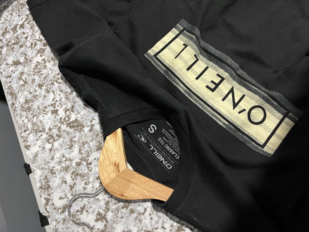 O'Neill Black Classic Tee Size S (Category: Tshirts & Polo Shirts ) located in Maasin. Submitted by niconii090 (Listing ID 1469170841, Image 3). Description: - Brand: O'Neill - Color: Classic Black - Material: 100% Cotton - Design: Rectangular box logo print in muted neutral tones - Details: Crew neck, short sleeves - Condition: Clean, no stains, no holes 📏 17 x 25 (inches).