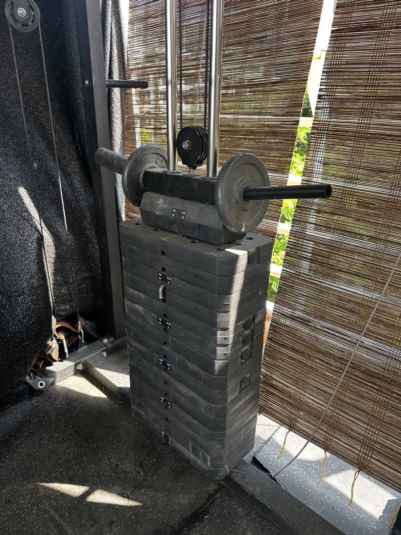 Orange and Black Smith Machine Power Cage with Cable Crossover (Category: Cardio & Fitness Machines) located in Pasig City. Submitted by hernandez2001 (Listing ID 1469273419, Image 1). Description: Complete home gym setup featuring a Smith machine, dual cable pulley, and pull-up bar. Heavy-duty orange and black steel frame with rubber flooring mats included. Perfect for full-body workouts. Buyer must dismantle upon pickup. PM for details!.
