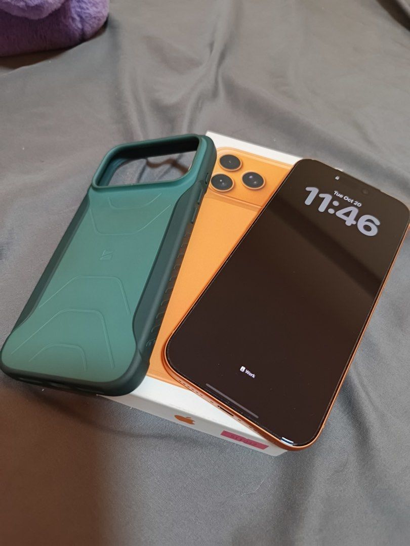 Orange Smartphone with Box and Green Case (Category: iPhone 17 Series) located in Muntinlupa City. Submitted by cloude3 (Listing ID 1469205815, Image 1). Description: iPhone 17 Pro Max 256GB Cosmic Orange No issue 100% Smooth With screen protector and case since day 1 100% Battery Never been repaired Purchased from PowerMac Includes original box and contents RFS: Upgrading.