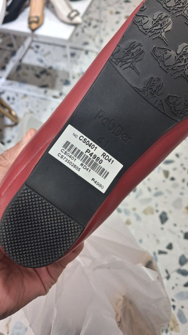 PabDer Donna Red Ballet Flats Size 41 (Category: Flats & Sandals) located in Cebu City. Submitted by dojpreluv (Listing ID 1469188419, Image 3). Description: - Brand/Model: PabDer Donna ballet flats - Size: 8 - Color: Deep red - Design: Classic round toe with a sweet front bow and slip-on style - Condition: Clean insoles, textured rubber outer soles for grip, and original barcode sticker still attached - Perfect for effortless daily wear and addi