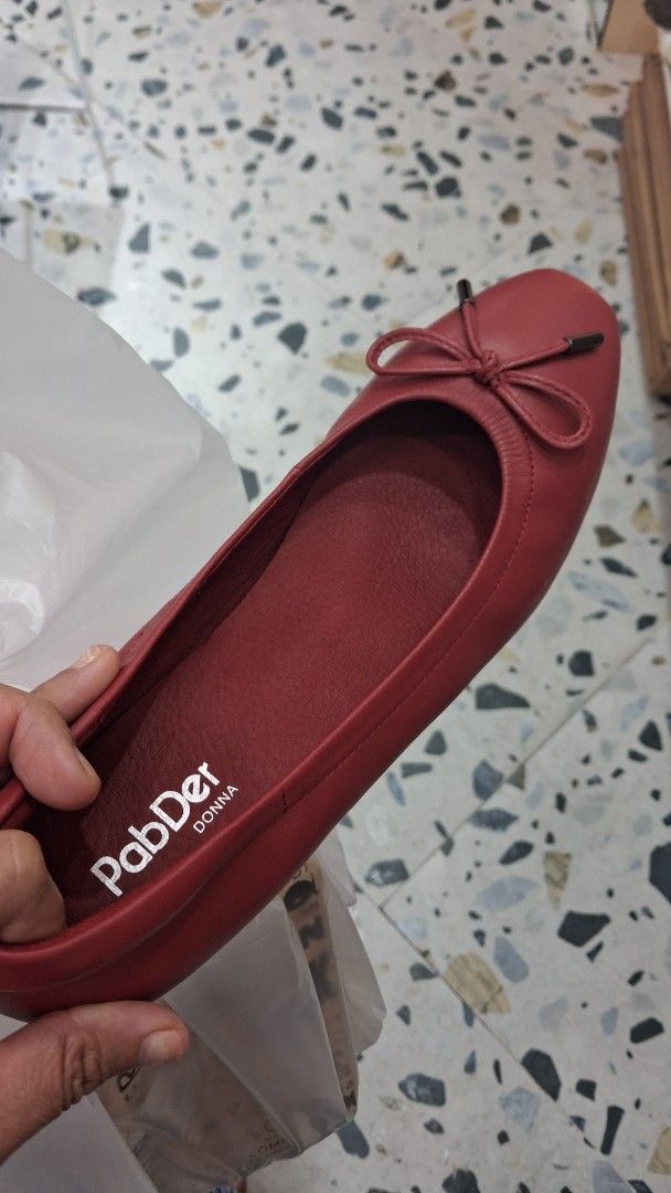 PabDer Donna Red Ballet Flats Size 41 (Category: Flats & Sandals) located in Cebu City. Submitted by dojpreluv (Listing ID 1469188419, Image 2). Description: - Brand/Model: PabDer Donna ballet flats - Size: 8 - Color: Deep red - Design: Classic round toe with a sweet front bow and slip-on style - Condition: Clean insoles, textured rubber outer soles for grip, and original barcode sticker still attached - Perfect for effortless daily wear and addi