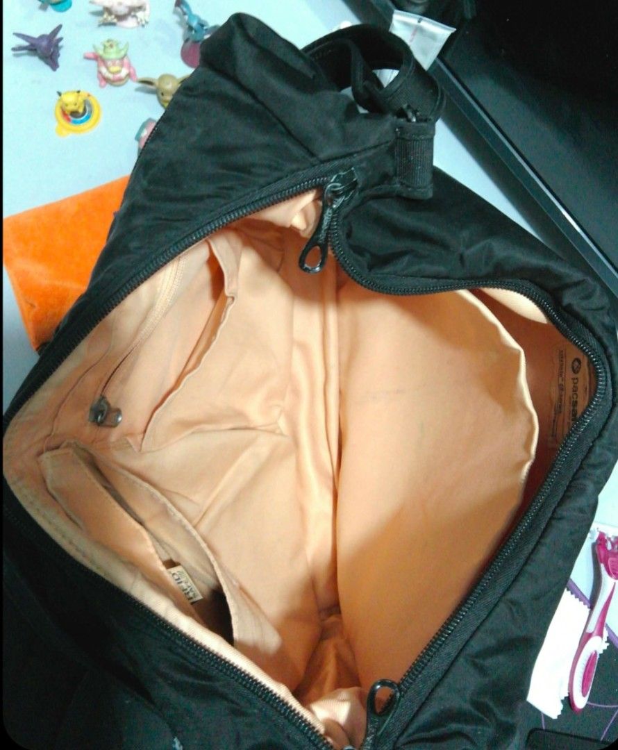 Pacsafe Black Anti-Theft Shoulder Bag (Category: Laptop Bags & Sleeves) located in Mandaluyong City. Submitted by gantan.tree (Listing ID 1469235654, Image 2). Description: - Brand/Model: Pacsafe Anti-Theft Shoulder Bag (Black) size: 15" X 10.5" X 4" strap 30" (shortest length) - Exterior: Durable nylon / secure zippered front pocket and side pocket - Interior: Light beige lining with organized pockets and RFID-safe compartments - Security: Equip