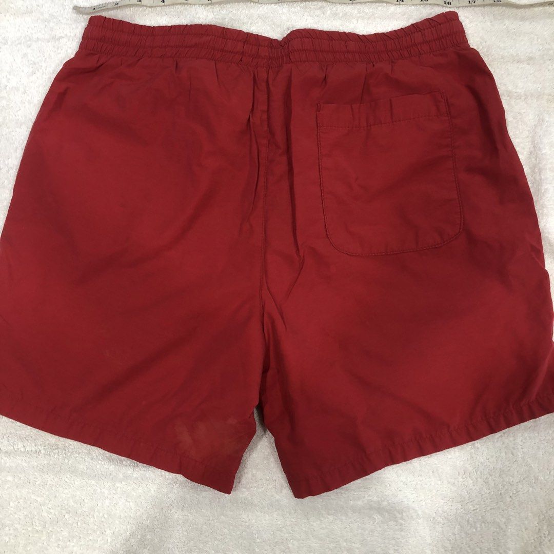 Pacsun Red Drawstring Swim Shorts Size M (Category: Swim Trunks & Board Shorts) located in Manila. Submitted by janmichael26601 (Listing ID 1469206967, Image 2). Description: - Brand: Pacsun - Color: Red - Size: Medium - Material: Comfortable cotton and nylon blend - Details: White drawstring waist, white inner mesh lining, and a right-side back pocket - Condition: Good for casual beach wear, with a few notable dark spots and stains on the lower 