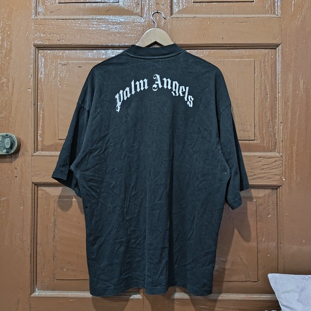 Palm Angels Bear Graphic Tee Black Oversized (Category: Tshirts & Polo Shirts ) located in Clarin. Submitted by thrftpngsnihan25 (Listing ID 1469164926, Image 3). Description: - Brand: Palm Angels - Color: Dark washed black - Design: Iconic headless bear graphic with classic gothic logo - Fit: Trendy oversized fit with short sleeves and ribbed crewneck - Material: Premium heavy cotton feel - Condition: Brand new with tags - Meet-ups and nationwid