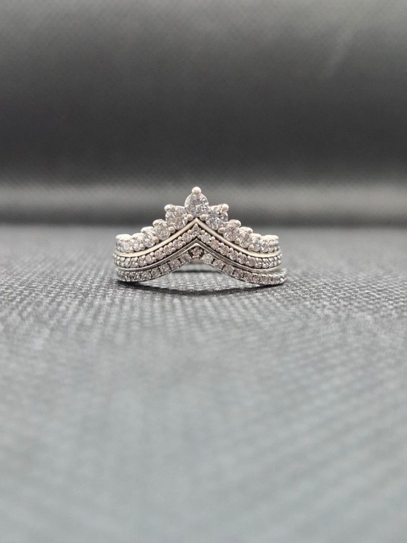 Pandora Princess & Sparkling Wishbone Ring [2 rings] (Category: Rings) located in Manila. Submitted by prelovedbyc.hannah (Listing ID 1469334163, Image 2). Description: - Brand: Pandora - Model: Princess & Sparkling Wishbone Ring - Design: 2 pieces V-shaped crown design with sparkling cubic zirconia stones - Size: European 52/ US 6 - Material: Sterling silver - Inclusion: Original Pandora gift box - Condition: with tarnishing.