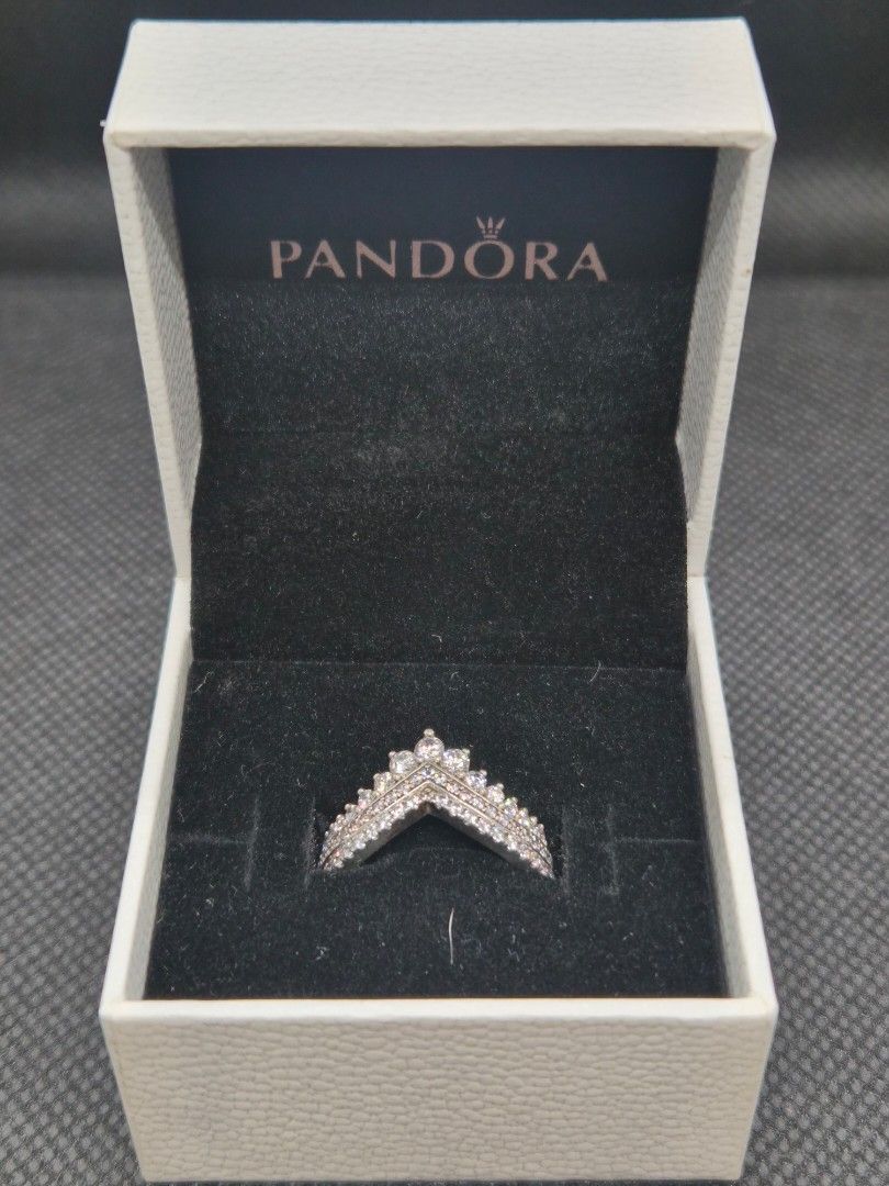 Pandora Princess & Sparkling Wishbone Ring [2 rings] (Category: Rings) located in Manila. Submitted by prelovedbyc.hannah (Listing ID 1469334163, Image 1). Description: - Brand: Pandora - Model: Princess & Sparkling Wishbone Ring - Design: 2 pieces V-shaped crown design with sparkling cubic zirconia stones - Size: European 52/ US 6 - Material: Sterling silver - Inclusion: Original Pandora gift box - Condition: with tarnishing.