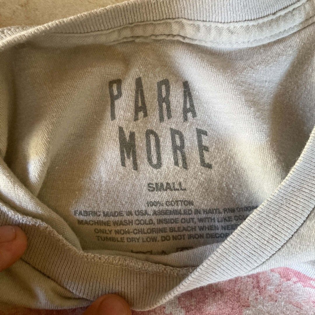 Paramore tee (Category: Activewear) located in Bulacan. Submitted by ajinn_ (Listing ID 1469366469, Image 2). Description: issue 1 pin hole.