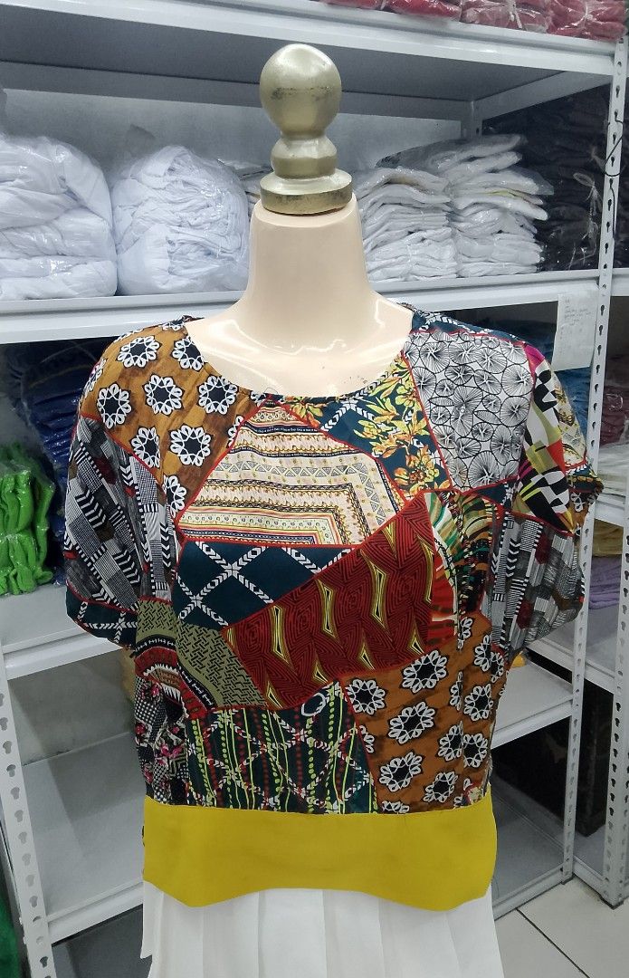 Patchwork Print Short Sleeve Top with Yellow Band Graphic print (Category: Blouses) located in Midsayap. Submitted by jarethshop (Listing ID 1469323598, Image 1). Description: - Style: Short sleeve top with a relaxed, loose fit - Design: Mixed patchwork patterns in brown, red, black, and white with a bright yellow bottom hem - Neckline: Classic round neckline - Fabric: Lightweight and breathable - Versatility: Easy to pair with skirts or trousers