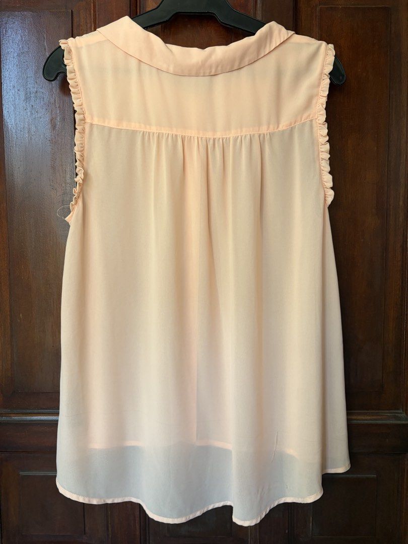 peach sleeveless blouse (Category: Sleeveless) located in Las Pinas. Submitted by nylth (Listing ID 1469167990, Image 3). Description: condition: good overall with minor wear & run near the bottom hem.