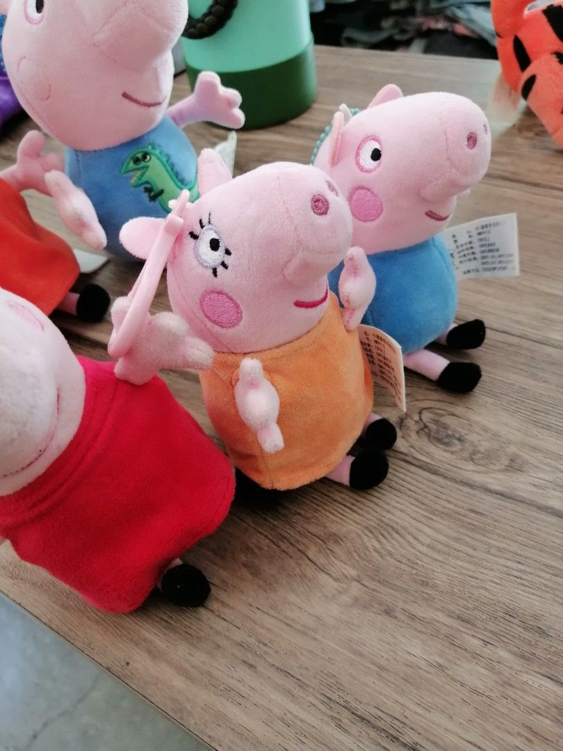 Peppa Pig Plush Toy Keychains Set of Five (Category: Plushies & Soft Toys) located in Angono. Submitted by rlinee_93 (Listing ID 1469274673, Image 3). Description: - Set of 5 adorable Peppa Pig plush keychains and toys - Includes characters in red dress, blue dinosaur shirt, orange dress, and blue dress - Made of soft, clean, and well-kept material.