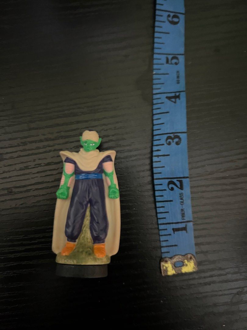 Piccolo Dragon Ball Z Figurine (Category: Figurines & Statues) located in Manila. Submitted by shoptoji (Listing ID 1469281639, Image 2). Description: - WYSIWYG , pm for more pics - Character: Piccolo from Dragon Ball Z - Size: Around 4 inches tall - Details: Wears signature cape and purple outfit with solid paint work - Base: Hollow center hole, perfect for a stand or pen topper - Condition: Great small collectible piece for anime fans.