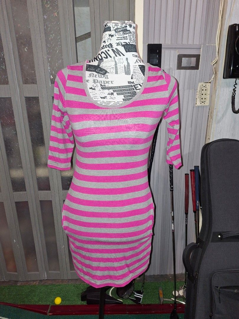 Pink and Grey Striped Dress (Category: Dresses) located in Manila. Submitted by mialiurshop (Listing ID 1469226288, Image 1). Description: - Design: Pink and grey striped pattern - Fit: Bodycon, snug, and stretchy fabric - Details: Three-quarter length sleeves and round neckline - Style: Casual piece, perfect for daily wear - Condition: Grab it before it's gone!.