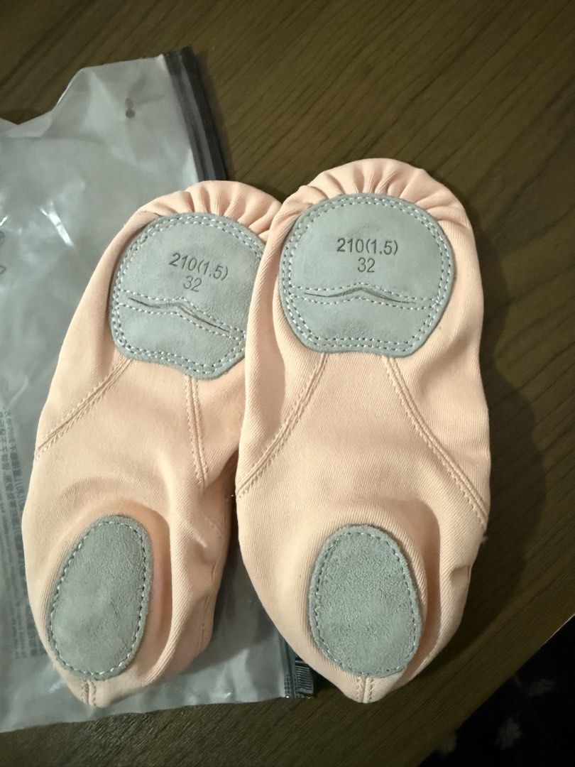 Pink Ballet Shoes Split Sole Size 32 (Category: Babies & Kids Fashion) located in Muntinlupa City. Submitted by eksamano (Listing ID 1469170950, Image 2). Description: - Color: beige Pink - Size: 32 - Condition: Unworn, clean fabric upper - Soles: Split suede leather at ball and heel - Design: Elastic cross straps for a secure fit - Strechable canvas material can grow into it unlike plain canvas ballet shoes.