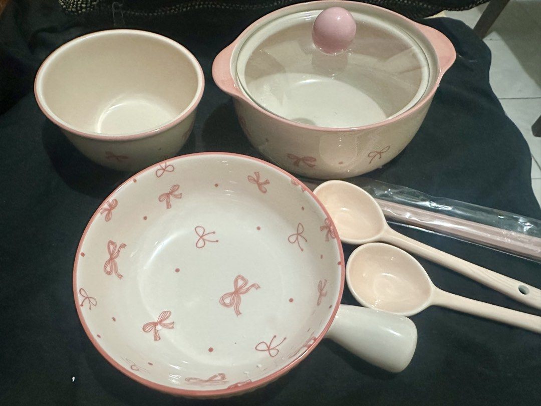 Set Pink bow ceramic tableware set with pot and bowls (Category: Dinnerware & Cutlery) located in Manila. Submitted by shayne2 (Listing ID 1469282908, Image 2). Description: Brand new complete set - Pink and white ceramic dinnerware set with cute ribbon print - Includes lidded pot, large handled bowl, regular bowl, 2 spoons, and chopsticks in wrapper - Features lovely pink rims for an aesthetic dining setup - Clean and ready to use for serving me