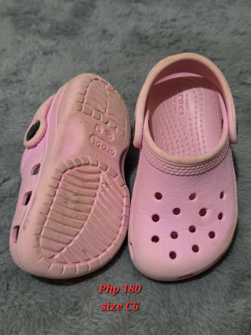 Pink Crocs Classic Clog (Category: Babies & Kids Fashion) located in Bulacan. Submitted by gtrvddg (Listing ID 1469222387, Image 1). Description: - Item: Toddler Pink Crocs Clogs - Size: C6 (marked on sole) - Features: Slip-on design, breathable ventilation holes, and secure heel strap - Condition: Clean, ready for use, with moderate wear on the tread - Comfort: Original Iconic Crocs comfort branding inside.