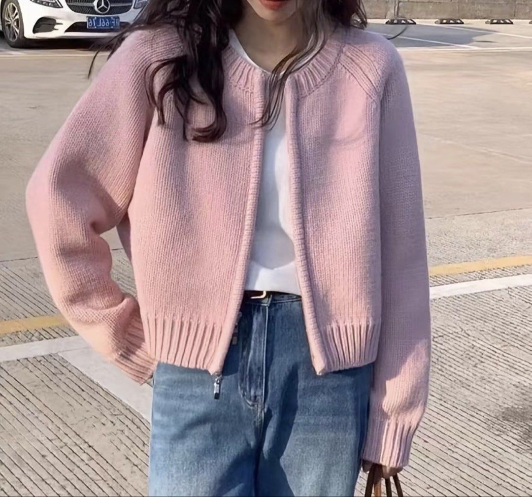 Pink Knit Zip Cardigan Sweater (Category: Coats, Jackets and Outerwear) located in Taguig. Submitted by aliii30 (Listing ID 1469239358, Image 2). Description: - Color: Soft pink - Style: Knit cardigan with full front zipper and relaxed drop-shoulder fit - Details: Chunky ribbed collar, cuffs, and hem - Versatility: Easy to layer over tees or tanks - Condition: Great casual piece for chilly days.