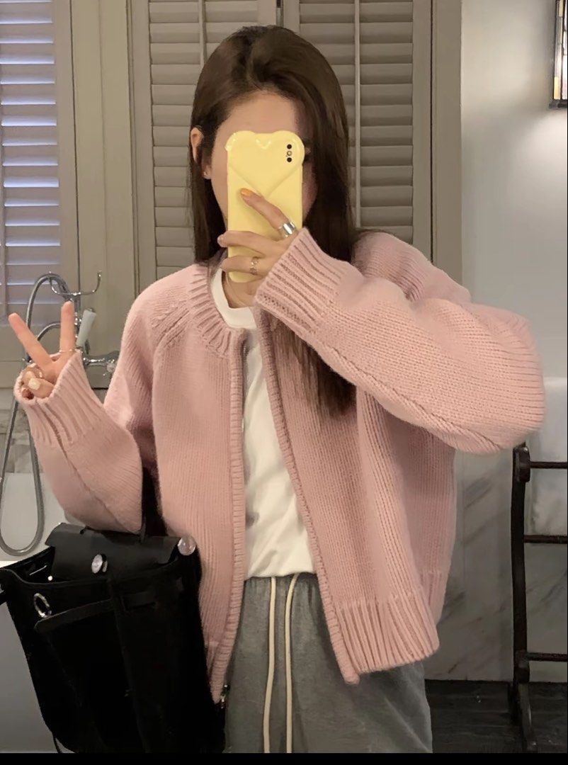 Pink Knit Zip Cardigan Sweater (Category: Coats, Jackets and Outerwear) located in Taguig. Submitted by aliii30 (Listing ID 1469239358, Image 1). Description: - Color: Soft pink - Style: Knit cardigan with full front zipper and relaxed drop-shoulder fit - Details: Chunky ribbed collar, cuffs, and hem - Versatility: Easy to layer over tees or tanks - Condition: Great casual piece for chilly days.