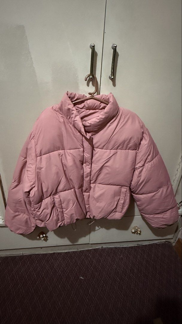 Pink Puffer Jacket Winter Coat Cropped Style (Category: Coats, Jackets and Outerwear) located in Cavite. Submitted by jcai03 (Listing ID 1469308642, Image 1). Description: - Color: Pink - Style: Cropped puffer jacket with a stylish quilted design - Neckline: High collar to keep your neck extra warm - Closure: Convenient front button snap closure - Pockets: Functional side pockets on each side - Fit: Adjustable drawstring hem at the bottom - Comfo