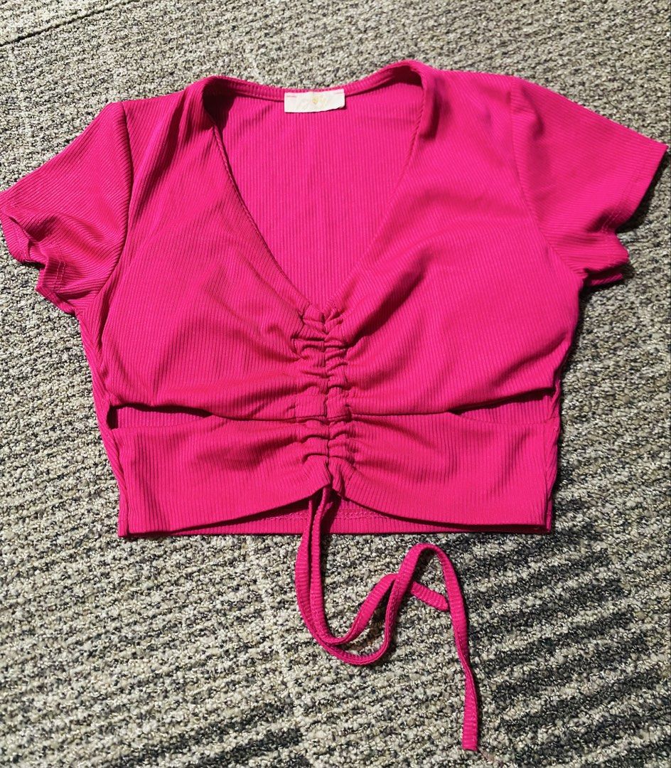 Pink Ribbed Crop Top with Drawstring Detail (Category: Sleeveless) located in Marikina City. Submitted by jessylady10 (Listing ID 1469328811, Image 1). Description: - Style: Bright pink ribbed crop top - Details: V-neck with adjustable drawstring ruched front and hanging tie hem - Material: Soft, stretchy ribbed fabric (Made in Italy) - Fit: Short sleeves, perfect for high-waisted bottoms - Condition: Excellent Gcash payment, Lalamove delivery.