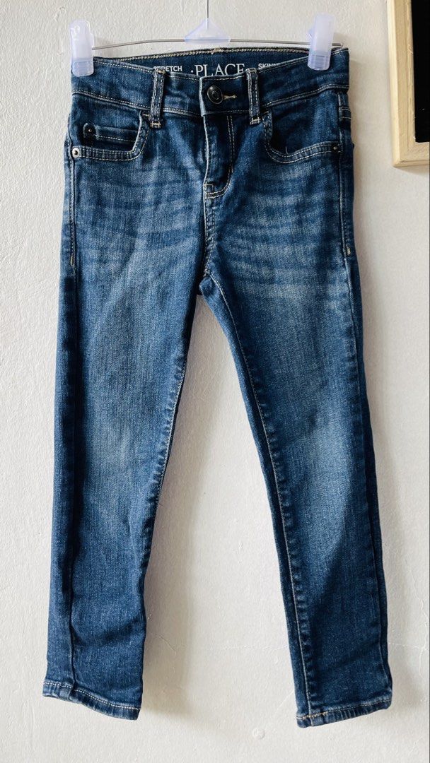 PLACE Stretch Skinny Jeans (Category: Babies & Kids Fashion) located in Caloocan City. Submitted by lovemyclothes21 (Listing ID 1469272058, Image 1). Description: - Size: 5 (fits ages 4-5 years old) - Color: Dark blue wash - Material: Stretchy denim for comfortable movement - Waistband: Adjustable setup for a better fit - Details: Classic 5-pocket styling with contrast stitching - Closure: Front button and zip - Origin: Made in Bangladesh.